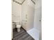 Bathroom featuring a toilet, walk-in shower, and wood-look floors at 1311 Aaron Dr, Shelbyville, IN 46176