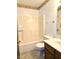 Bathroom featuring a cream tub and shower combination and gray floors at 1311 Aaron Dr, Shelbyville, IN 46176