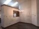 Bright dining area with a view to the kitchen, chandelier, and hard wood floors at 1311 Aaron Dr, Shelbyville, IN 46176