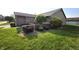 Well-maintained front yard with brick accents, green grass, and decorative bushes at 1311 Aaron Dr, Shelbyville, IN 46176
