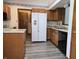 Well-lit kitchen featuring modern appliances, granite countertops and laminate flooring at 1311 Aaron Dr, Shelbyville, IN 46176
