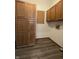 Spacious laundry room with washer/dryer hookups, laminate floors, and cabinet storage at 1311 Aaron Dr, Shelbyville, IN 46176