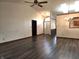 Open-concept living room with high ceilings and laminate wood floors at 1311 Aaron Dr, Shelbyville, IN 46176