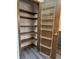 Walk-in pantry features wooden shelves and door rack storage at 1311 Aaron Dr, Shelbyville, IN 46176