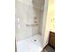 A marble surround walk-in shower with grab bar and built in shelf at 1311 Aaron Dr, Shelbyville, IN 46176