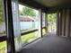 Cozy sun room with large windows offering views of the backyard at 1311 Aaron Dr, Shelbyville, IN 46176