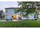 Two-story backyard with patio, lawn and exterior view through open sliding glass doors at 1343 Turfway Dr, Avon, IN 46123