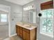 Bathroom with double sinks, large mirror and natural lighting at 1343 Turfway Dr, Avon, IN 46123