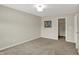 Bedroom with neutral walls, carpet, and artwork; doorway visible with closet at 1343 Turfway Dr, Avon, IN 46123