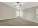 Spacious bedroom with carpet, a ceiling fan, and bright windows at 1343 Turfway Dr, Avon, IN 46123