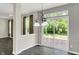 Bright dining area features a sliding glass door to the backyard and elegant light fixtures at 1343 Turfway Dr, Avon, IN 46123