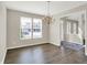 Inviting dining room with dark wood floors, ample natural light, and chandelier at 1343 Turfway Dr, Avon, IN 46123