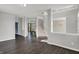 Spacious living room with hardwood flooring and view of the carpeted staircase at 1343 Turfway Dr, Avon, IN 46123