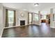 Comfortable living room boasts a fireplace, hardwood floors, and natural lighting at 1343 Turfway Dr, Avon, IN 46123