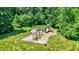 Aerial view of the community park's brand new playground area nestled amongst mature shade trees at 1343 Turfway Dr, Avon, IN 46123