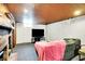 Finished basement with a fireplace, TV, and comfortable seating, ready for movie nights and gatherings at 1411 N Kenmore Rd, Indianapolis, IN 46219
