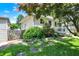 View of a well-maintained home with a charming porch and lush landscaping at 1411 N Kenmore Rd, Indianapolis, IN 46219