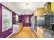 Modern kitchen featuring sleek appliances, stylish countertops, and contemporary fixtures at 1411 N Kenmore Rd, Indianapolis, IN 46219