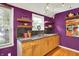 Stylish kitchen featuring stone countertops, stainless steel appliances, and modern decor at 1411 N Kenmore Rd, Indianapolis, IN 46219