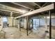 Unfinished basement with exposed beams and concrete floor offers potential for customization at 1511 E Edwards Ave, Indianapolis, IN 46227