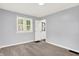 Inviting bedroom with soft gray walls, plush carpeting, and natural light from the window at 1511 E Edwards Ave, Indianapolis, IN 46227