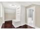 Bedroom featuring a built-in bench with storage and closet, complemented by hardwood floors at 1511 E Edwards Ave, Indianapolis, IN 46227