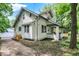 Charming two-story home with inviting front porch and well-manicured yard at 1511 E Edwards Ave, Indianapolis, IN 46227