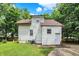 Rear view of home featuring well-maintained siding, and lush green lawn at 1511 E Edwards Ave, Indianapolis, IN 46227