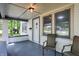 Inviting front porch with seating, offering a view of the neighborhood and classic architectural details at 1511 E Edwards Ave, Indianapolis, IN 46227