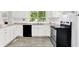 Renovated kitchen featuring stainless steel appliances and ample cabinet space at 1511 E Edwards Ave, Indianapolis, IN 46227