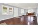 Spacious living room with hardwood floors, natural light, and a front entrance at 1511 E Edwards Ave, Indianapolis, IN 46227