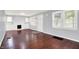 Bright living room features hardwood floors, a fireplace, and plenty of natural light at 1511 E Edwards Ave, Indianapolis, IN 46227