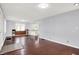 Bright, open living room with hardwood floors is ready for entertaining at 1511 E Edwards Ave, Indianapolis, IN 46227