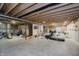 Unfinished basement with exposed ceiling beams, concrete flooring, and visible utilities at 15598 Memorial Way, Fishers, IN 46037