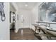 Bright entryway featuring wood floors, a decorative table, and a view into the living room at 15598 Memorial Way, Fishers, IN 46037