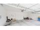 Clean and organized two-car garage with white walls, overhead door, and ample storage space at 15598 Memorial Way, Fishers, IN 46037
