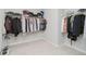 A walk-in closet provides organized storage with clothing racks spanning the interior on a neutral carpeted floor at 15598 Memorial Way, Fishers, IN 46037