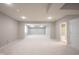 Spacious basement with neutral walls and plush carpeting offers versatile living space at 1590 Birchfield Dr, Westfield, IN 46074