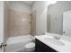Clean, well-lit bathroom featuring a shower-tub combo with tile surround and modern sink at 1590 Birchfield Dr, Westfield, IN 46074