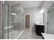 Modern bathroom featuring glass shower, tiled floors, and dark vanity with plenty of counter space at 1590 Birchfield Dr, Westfield, IN 46074