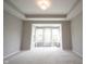 Spacious bedroom featuring a tray ceiling, neutral walls, and bright natural light from multiple windows at 1590 Birchfield Dr, Westfield, IN 46074