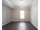 Spacious room with dark hardwood floors, neutral walls, and natural light from the window at 1590 Birchfield Dr, Westfield, IN 46074