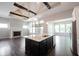 Kitchen featuring center island, stainless steel appliances, and access to the living room at 1590 Birchfield Dr, Westfield, IN 46074