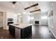 Open-concept kitchen with a center island and view to the living room with a fireplace at 1590 Birchfield Dr, Westfield, IN 46074
