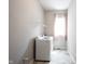 Bright laundry room featuring new washer/dryer and open shelving near a window at 1590 Birchfield Dr, Westfield, IN 46074