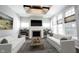 Bright living room featuring a fireplace, built-in shelves, comfortable sofas, and ample windows at 1590 Birchfield Dr, Westfield, IN 46074