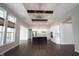 Bright living room and kitchen featuring an island, recessed lighting, and dark wood floors at 1590 Birchfield Dr, Westfield, IN 46074
