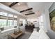 Open concept living room and kitchen, with an island, white cabinets and stainless steel appliances at 1590 Birchfield Dr, Westfield, IN 46074
