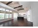 Spacious open-concept living room featuring dark wood floors and kitchen with center island at 1590 Birchfield Dr, Westfield, IN 46074