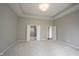 Spacious main bedroom with carpet, tray ceiling, and adjacent bathroom, perfect for relaxation at 1590 Birchfield Dr, Westfield, IN 46074